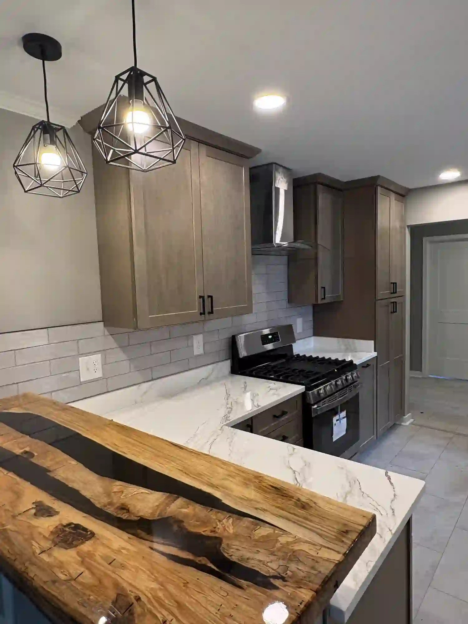 Sheridan Drive finished kitchen with live-edge wood peninsula